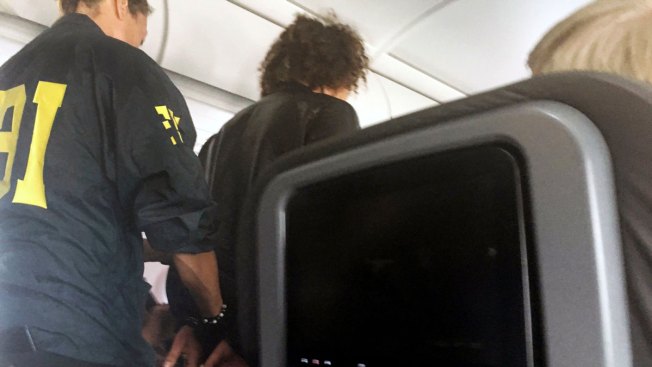 American Airlines passenger 'duct taped to seat' after attempting to enter cockpit American Airlines passenger 'duct taped to seat' after attempting to enter cockpit