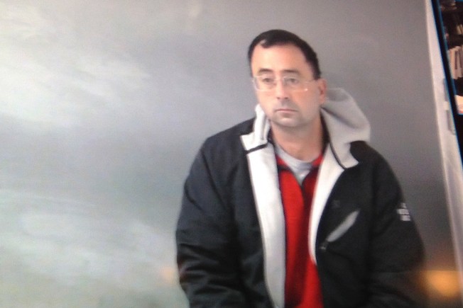 Michigan sports doctor back in court on assault allegations