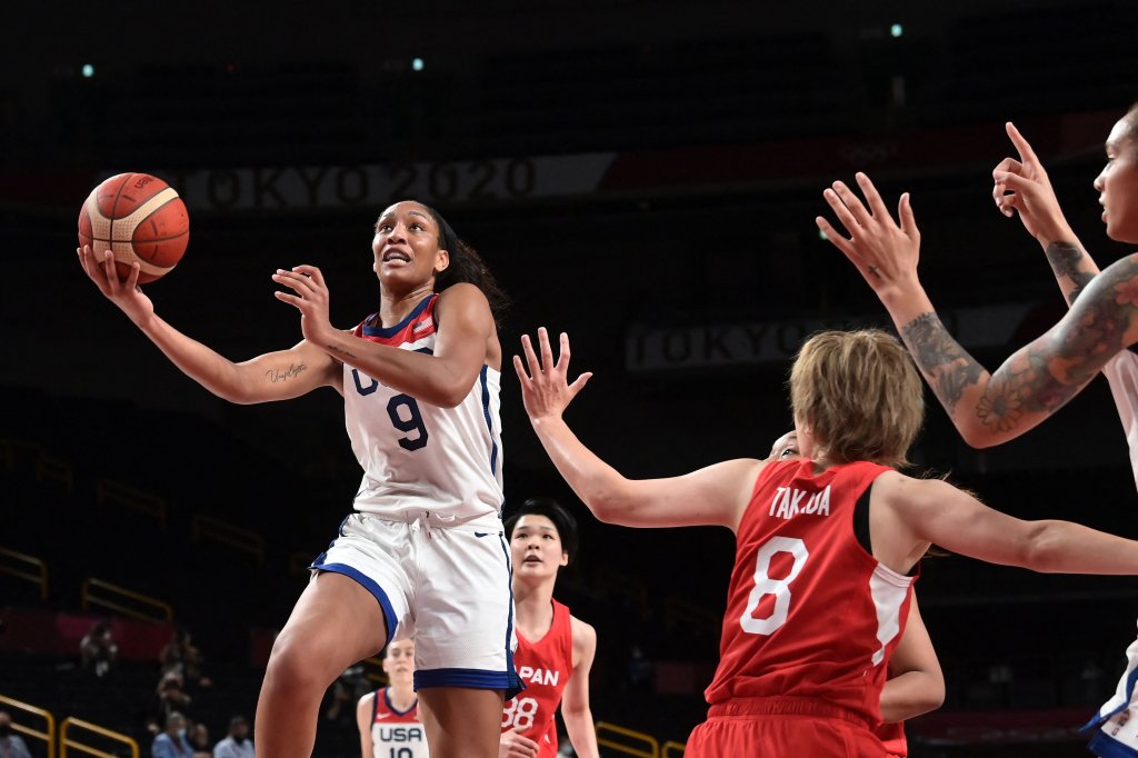 USA's A'ja Wilson (L) goes to the basket past Japan's Maki Takada (2R) in the women's final basketball match between USA and Japan during the Tokyo 2020 Olympic Games at the Saitama Super Arena in Saitama on Aug. 8, 2021.
