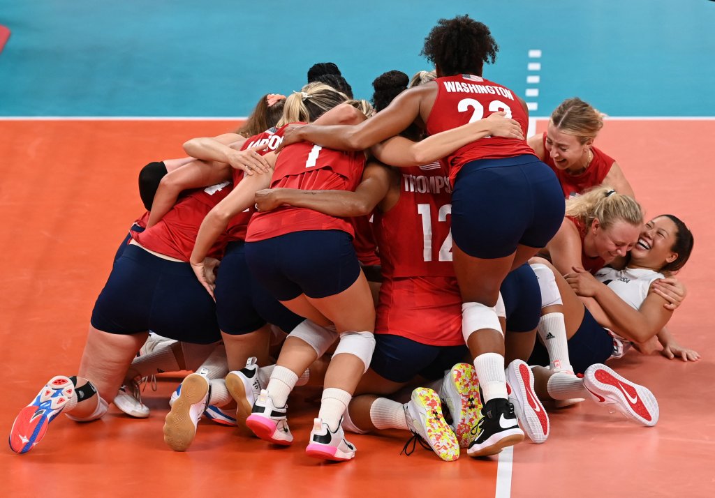 USA's players celebrate their victory in the women's gold medal volleyball match between Brazil and USA during the Tokyo 2020 Olympic Games at Ariake Arena in Tokyo, Japan on Aug. 8, 2021.