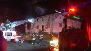 A fire at a multi-family home displaced 16 people overnight Friday, Dec. 27, 2019 in Hull, Massachusetts.