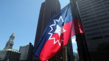 The Juneteenth flag is raised at Boston City Hall