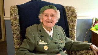 Ronnie Backenstoe, above, has been selling Girl Scout cookies since 1932.