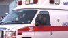 Ambulance rolls over near hospital entrance, trapping 2 EMTs inside