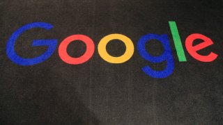 In this Monday, Nov. 18, 2019 file photo, the logo of Google is displayed on a carpet at the entrance hall of Google France in Paris.