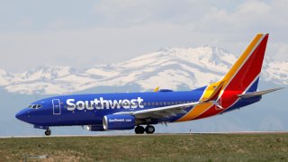 A Southwest Airlines jetliner taxis down a runway for take off from Denver International Airport as it gets back to life with the easing of restrictions to check the spread of the new coronavirus Wednesday, May 13, 2020, in Denver.