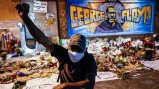 In this Monday, June 1, 2020 file photo, protesters gather at a memorial for George Floyd where he died outside Cup Foods on East 38th Street and Chicago Avenue in Minneapolis.