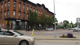 A car passes through downtown Winooski, Vermont, Tuesday June 9, 2020. Members of Winooski's immigrant community say that their members have been hit hard by the virus that causes COVID-19. The Vermont Health Department is working to contain the outbreak.