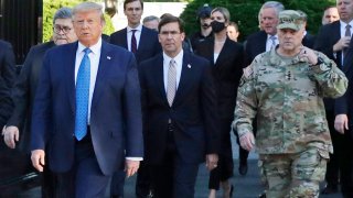 In this June 1, 2020 file photo, President Donald Trump departs the White House to visit outside St. John's Church, in Washington. Part of the church was set on fire during protests on Sunday night. Walking behind Trump from left are, Attorney General William Barr, Secretary of Defense Mark Esper and Gen. Mark Milley, chairman of the Joint Chiefs of Staff.
