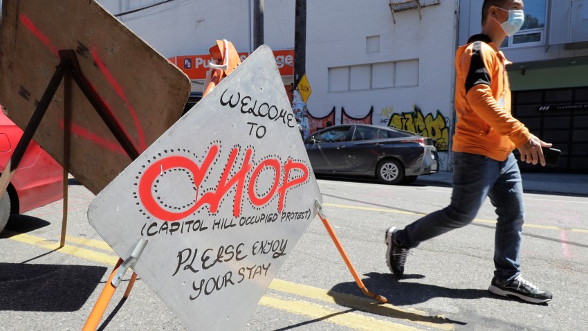 A sign welcomes visitors Monday, June 22, 2020, near an entrance to what has been named the Capitol Hill Occupied Protest zone in Seattle.