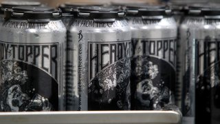 Cans of Heady Topper roll off the line at the Alchemist on Wednesday, Sept. 4, 2013, in Waterbury, Vermont.