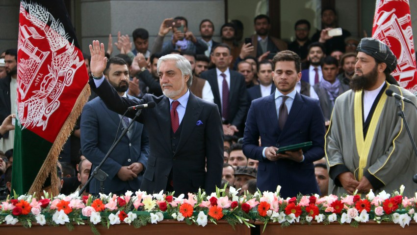 In this Monday, March 9, 2020, photo, Afghanistan's Abdullah Abdullah, front left, greets his supporters after being sworn in as president in Kabul, Afghanistan.