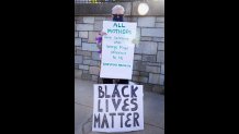 Renee Suchy from Hyde Park, Massachusetts,. at a Black Lives Matter vigil in West Roxbury on Monday, June 8, 2020.