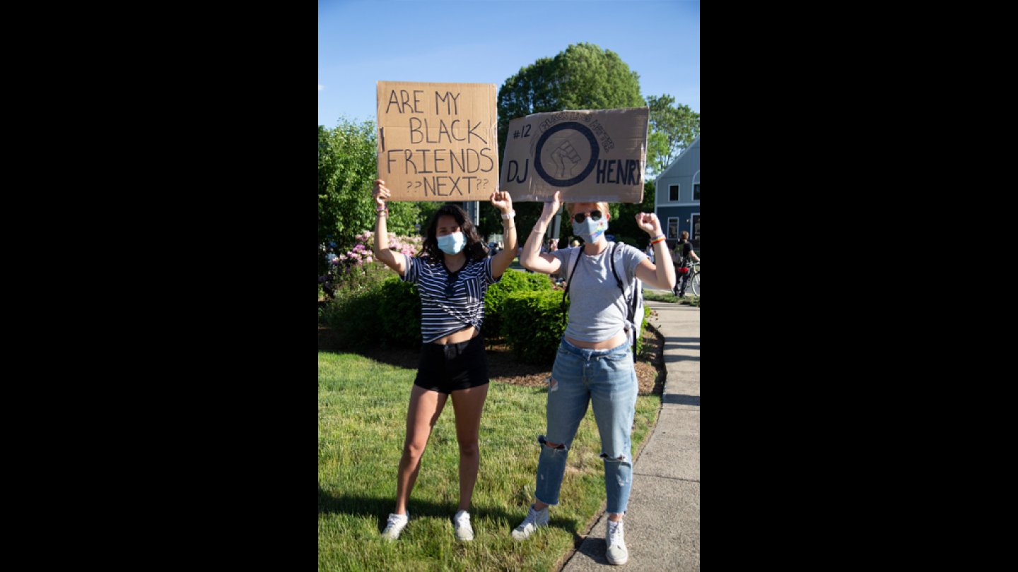 West Roxbury residents Clarissa Romero, a 25-year-old from Easton, Massachusetts, and Fanny Fellevik, a 26-year-old from Sweden, at a Black Lives Matter vigil in West Roxbury on Monday, June 8, 2020.