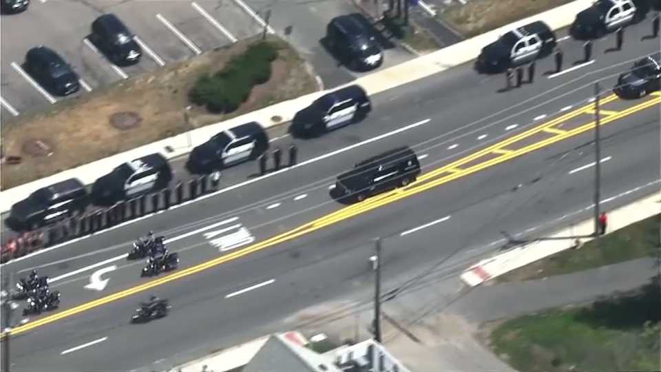 The body of slain Weymouth Police Officer Michael Chesna is transported to the medical examiner.