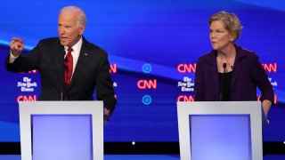 In this Oct. 15, 2019, file photo, former Vice President Joe Biden and Sen. Elizabeth Warren (D-MA) participate in the Democratic Presidential Debate at Otterbein University in Westerville, Ohio.