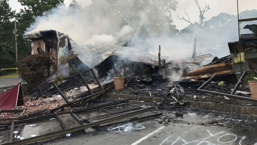 In this photo provided by the Marshall County Sheriff's Office, embers smolder on the remains of the First Pentecostal Church in Holly Springs, Miss., Wednesday, May 20, 2020.