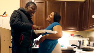 In this Thursday, Feb. 27, 2020, photo, Richard Butler and his fiance Amber laugh while they have breakfast in an apartment a friend is letting them live in on Chicago's Southside. Having food stamps offers Butler a stability he's rarely known in his 25 years. But that stability is being threatened for people like him, who are able-bodied, without dependents and between the ages 18 and 49.