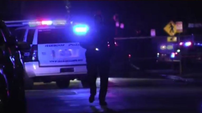 Police in Framingham, Mass. survey the scene of a double shooting.