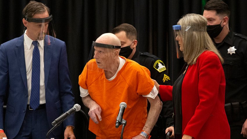 Joseph James DeAngelo, center, charged with being the Golden State Killer, is helped up by his attorney Diane Howard as Sacramento Superior Court Judge Michael Bowman enters the courtroom in Sacramento, Calif., June 29, 2020.