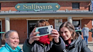 People outside Sullivan's Castle Island