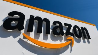 A picture shows the Amazon logo at the entrance area of the Amazon logistics centre in Amiens, northern France