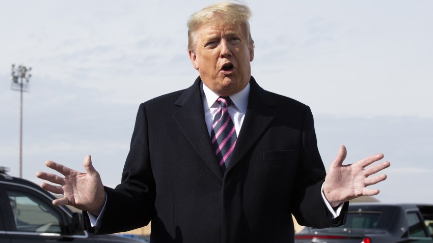 President Donald Trump speaks to members of the media before boarding Air Force One at Joint Base Andrews, Maryland, U.S., on Tuesday, Feb. 18, 2020.