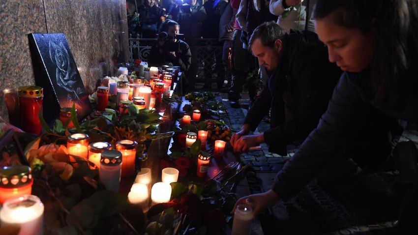 People light candles for Hanau shooting viictims