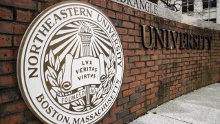 Signage is displayed at Northeastern University in Boston, Massachusetts, U.S., on Monday, April 20, 2020. College financial aid offices are bracing for a spike in appeals from students finding that the aid packages they were offered for next year are no longer enough after the coronavirus pandemic cost their parents jobs or income.