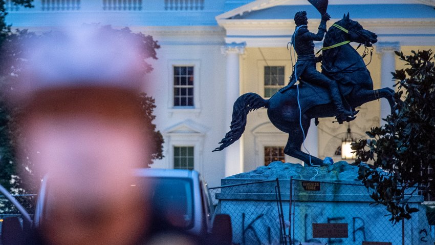 TOPSHOT – The equestrian statue of former US President General Andrew Jackson has ropes and chains still hanging, after protesters tried to topple it, at Lafayette square, in front of the White House, in Washington, DC on June 22, 2020. – A crowd of protestors tried to topple the statue of a former US president near the White House on the evening of June 22 as police responded with pepper spray to break up new demonstrations that erupted in Washington. (Photo by Eric BARADAT / AFP) (Photo by ERIC BARADAT/AFP via Getty Images)