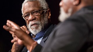 Bill Russell looks on as Dr. Harry Edwards asks him how he felt about students getting paid for sports while in college on the second day of the Civil Rights Summit at the LBJ Presidential Library in Austin, Texas, on April 9, 2014.