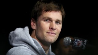 In this file photo, Tom Brady of the New England Patriots answers questions during a media availability for Super Bowl LII at the Mall of America on January 30, 2018 in Bloomington, Minnesota.
