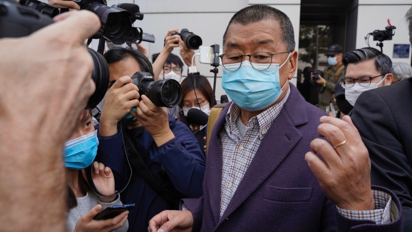 Founder of Hong Kong's Apple Daily newspaper, Jimmy Lai, walks out from a police station after being bailed out in Hong Kong, Friday, Feb. 28, 2020. Hong Kong's Apple Daily newspaper says the outspoken head of its publishing group, Lai, has been held by police over his participation in a protest march in August that was part of a months-long pro-democracy movement.