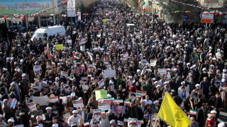 In this Jan. 3, 2017, file photo, Iranians take part during a state-organized rally against anti-government protests in the country, in Qom, Iran.