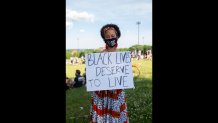 Yvonne Shinn from Canton, Mass. at a Juneteenth commemoration at Ronin Park in Dorchester on June 19, 2020.