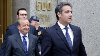 In this May 30, 2018, file photo, President Donald Trump's personal attorney Michael Cohen, right, leaves Federal Court, in New York.