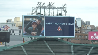 A "Happy Mother's Day" message on the Red Sox field board