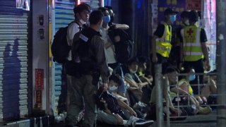 Police arrest anti-government protesters in Hong Kong, early Monday, May 11, 2020. A pro-democracy movement that paralyzed Hong Kong for months last year has shown signs of reviving in recent weeks as the coronavirus threat eases.