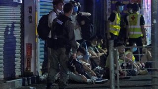 Police arrest anti-government protesters in Hong Kong, early Monday, May 11, 2020. A pro-democracy movement that paralyzed Hong Kong for months last year has shown signs of reviving in recent weeks as the coronavirus threat eases.