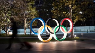 In this March 30, 2020, file photo, the Olympic rings are seen in Tokyo.