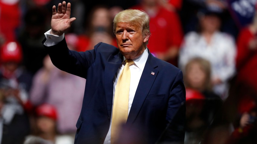 In this file photo, President Donald Trump waves at a campaign rally Thursday, Feb. 20, 2020, in Colorado Springs, Colo.