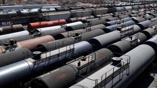Oil tank train cars sit idle Tuesday, April 21, 2020, in East Chicago, Ind. The world is awash in oil, there's little demand for it and we're running out of places to put it.