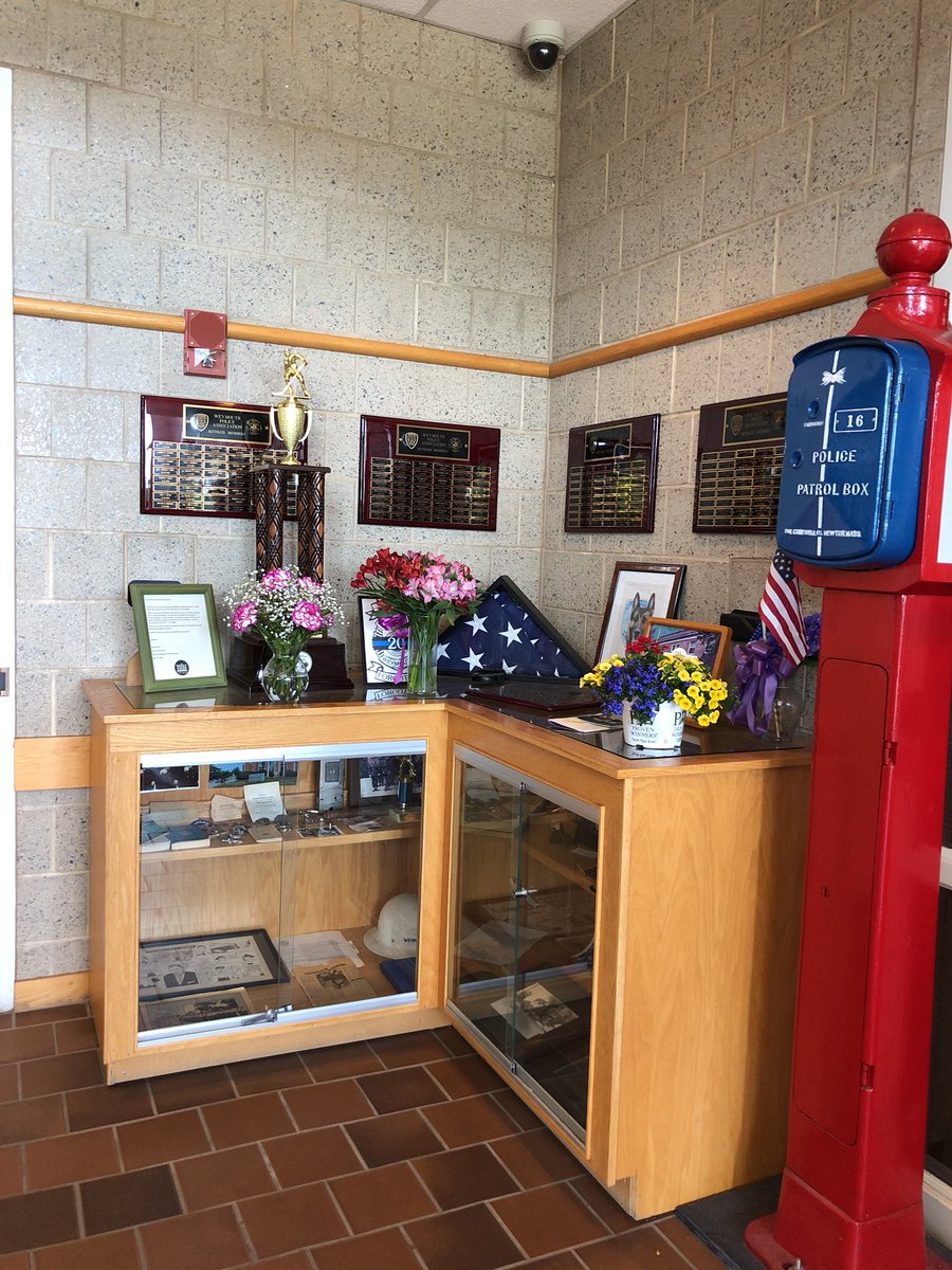 Flowers being dropped off at the Weymouth Police Department.