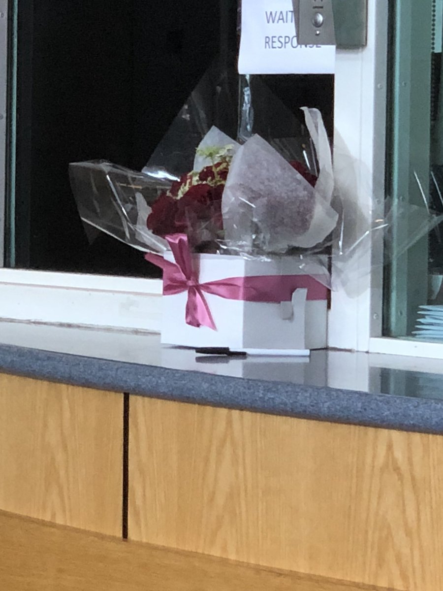 Flowers being dropped off at the Weymouth Police Department.