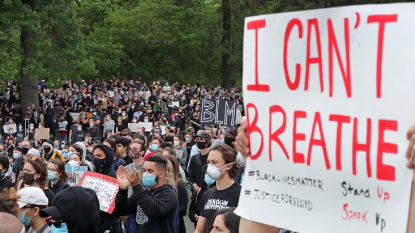 A file photo shows activists participate in a rally, vigil and march hosted by Black Lives Matter in Boston on June 2, 2020. The rally and vigil took place on Blue Hill Avenue by Franklin Park to honor George Floyd, Breanna Taylor, Ahmaud Arbery and local fallen people, and to protest police brutality.