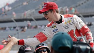 In this Sept. 5, 2015, file photo, Brad Keselowski is congratulated by crew members after winning the pole for the NASCAR Sprint Cup auto race at Darlington Raceway in Darlington, S.C.