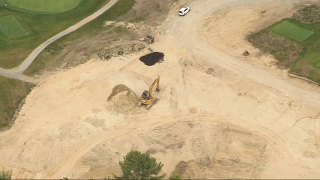 Construction at a Concord golf course where a worker fell into a trench