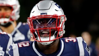 New England Patriots safety Devin McCourty (32) takes the field to