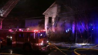 Two people were killed in a 2-alarm fire at 15 Highland Ave. in Fitchburg, Mass.