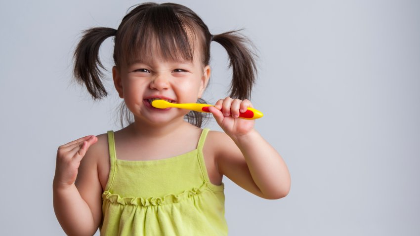 Girl brushing teeth